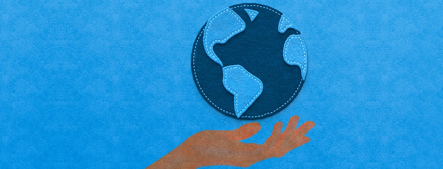 Graphic treatment of a hand holding the earth on a blue background