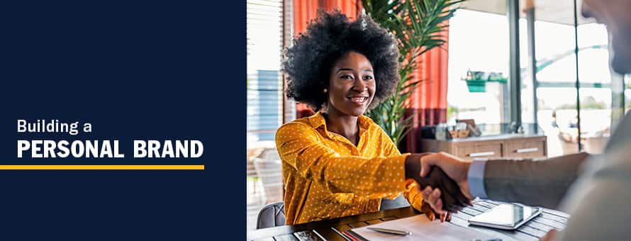 A woman shaking hands with an employer, looking to use her personal brand in a job interview with the text Building a Personal Brand