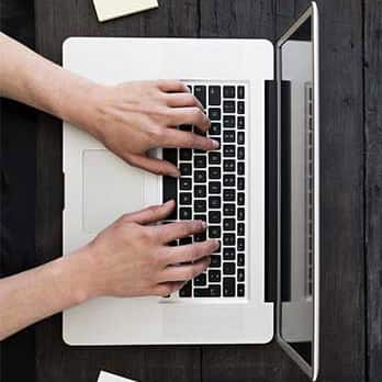 Someone working on a laptop