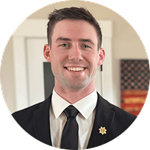 Jayson Camp, who earned his online degree from SNHU in 2022, wearing a suit and tie.